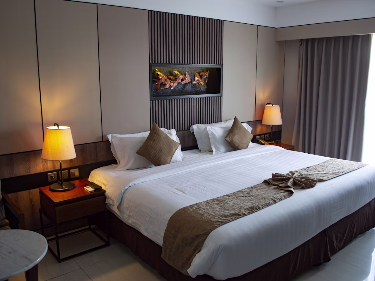 Elegant Velvet Crest room with a plush double bed and warm bedside lighting